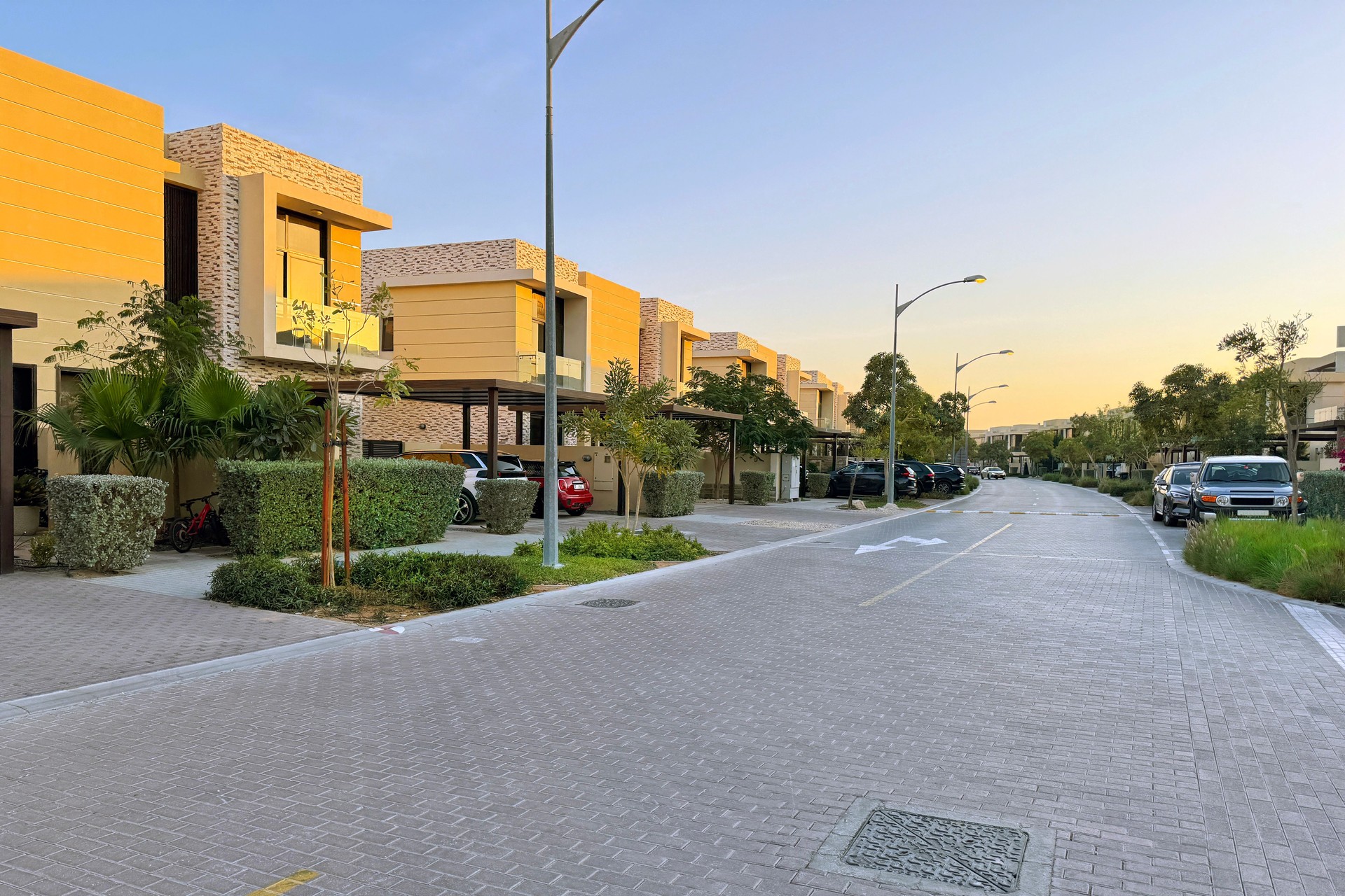 beautiful street with modern residential buildings, town houses on a summer day
